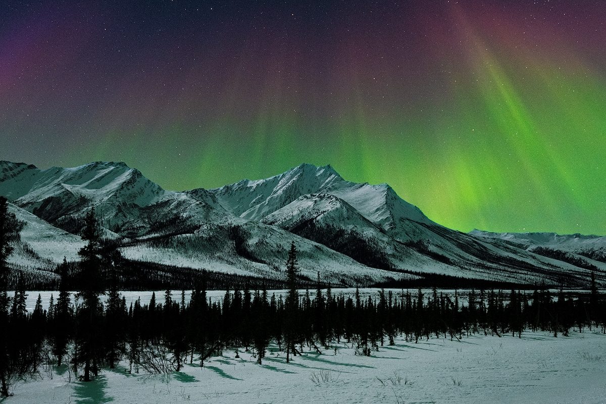 Aurora over Alaska mountains